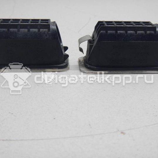 Фото Фонарь подсветки номера  5105886 для Ford Fiesta / Focus / Tourneo / C-Max / Ka