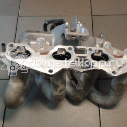 Фото Коллектор впускной для двигателя QG16DE для Nissan Sunny / Bluebird / Avenir / Primera / Almera 102-120 л.с 16V 1.6 л бензин 14010AU300