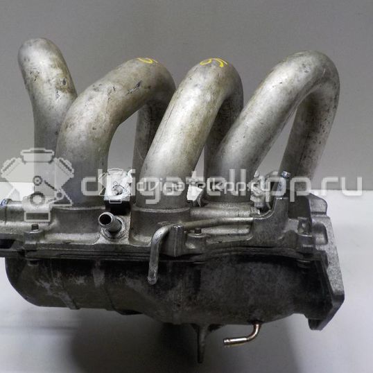 Фото Коллектор впускной для двигателя QG16DE для Nissan Sunny / Bluebird / Avenir / Primera / Almera 102-120 л.с 16V 1.6 л бензин 14010AU300