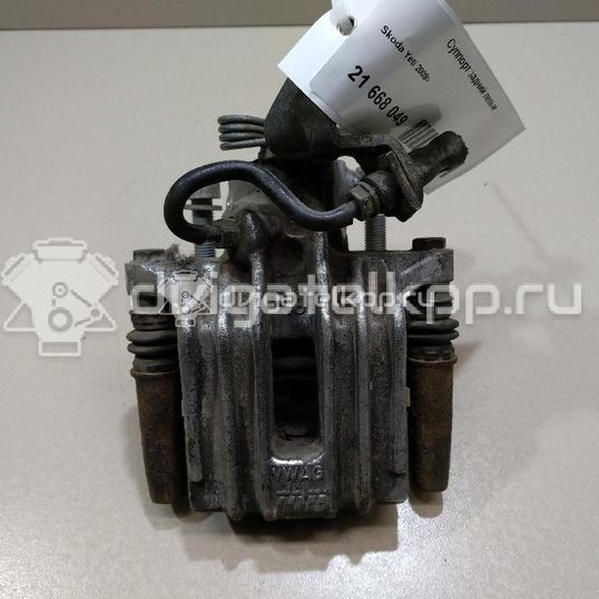 Фото Суппорт тормозной задний левый  1K0615423J для Skoda Roomster 5J / Octaviaii 1Z3 / Yeti 5L / Fabia / Octavia