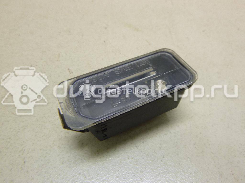 Фото Фонарь подсветки номера  5105886 для Ford Fiesta / Focus / Tourneo / C-Max / Ka {forloop.counter}}