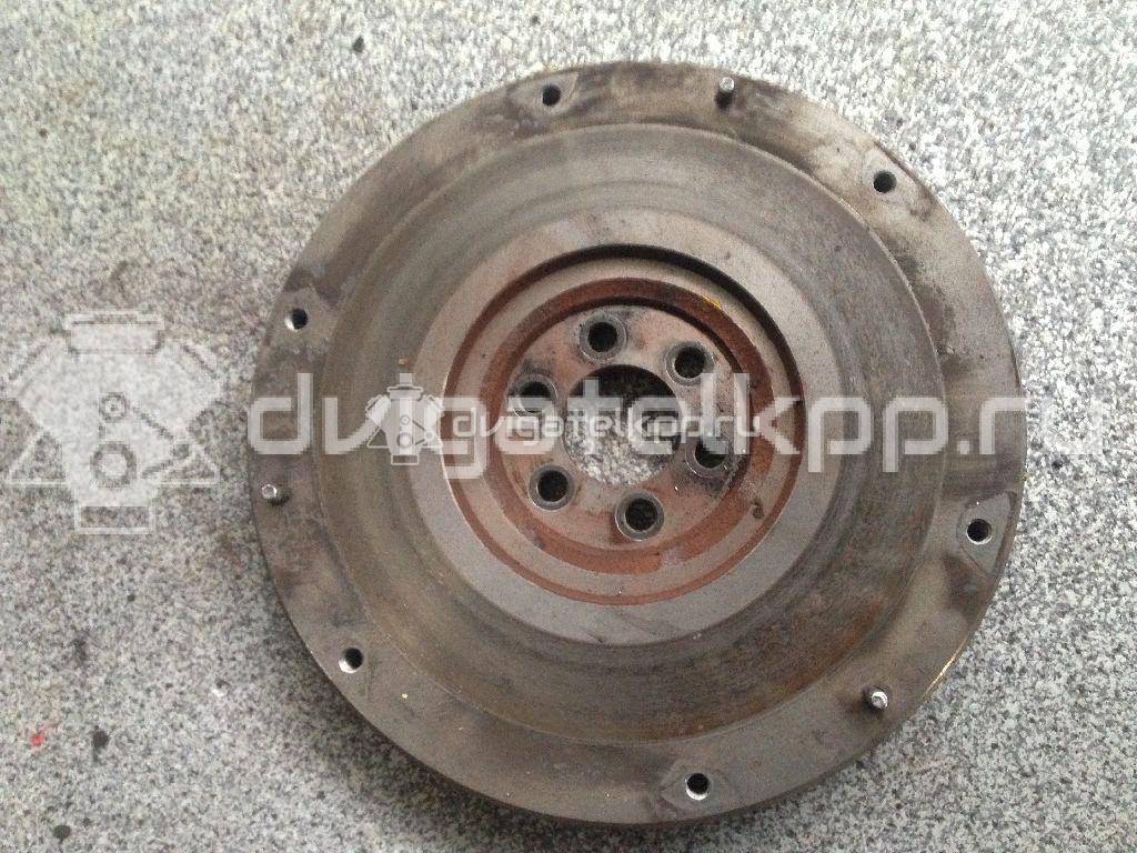 Фото Маховик для двигателя QG16DE для Nissan Sunny / Bluebird / Avenir / Primera / Almera 102-120 л.с 16V 1.6 л бензин 123119F600 {forloop.counter}}