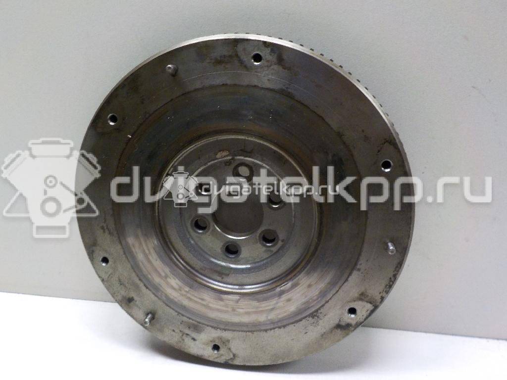 Фото Маховик для двигателя QG16DE для Nissan Sunny / Bluebird / Avenir / Primera / Almera 102-120 л.с 16V 1.6 л бензин 123119F600 {forloop.counter}}