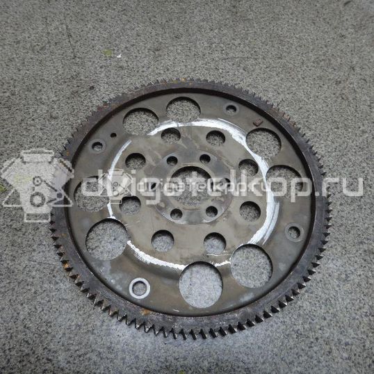 Фото Маховик для двигателя QG16DE для Nissan Sunny / Bluebird / Avenir / Primera / Almera 102-120 л.с 16V 1.6 л бензин 1233195F0A