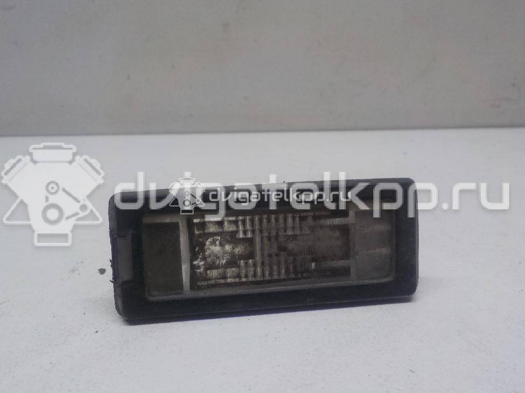 Фото Фонарь подсветки номера  8200013577 для Renault Modus Grand F Jp0 / Megane / Clio / Laguna / Scénic {forloop.counter}}